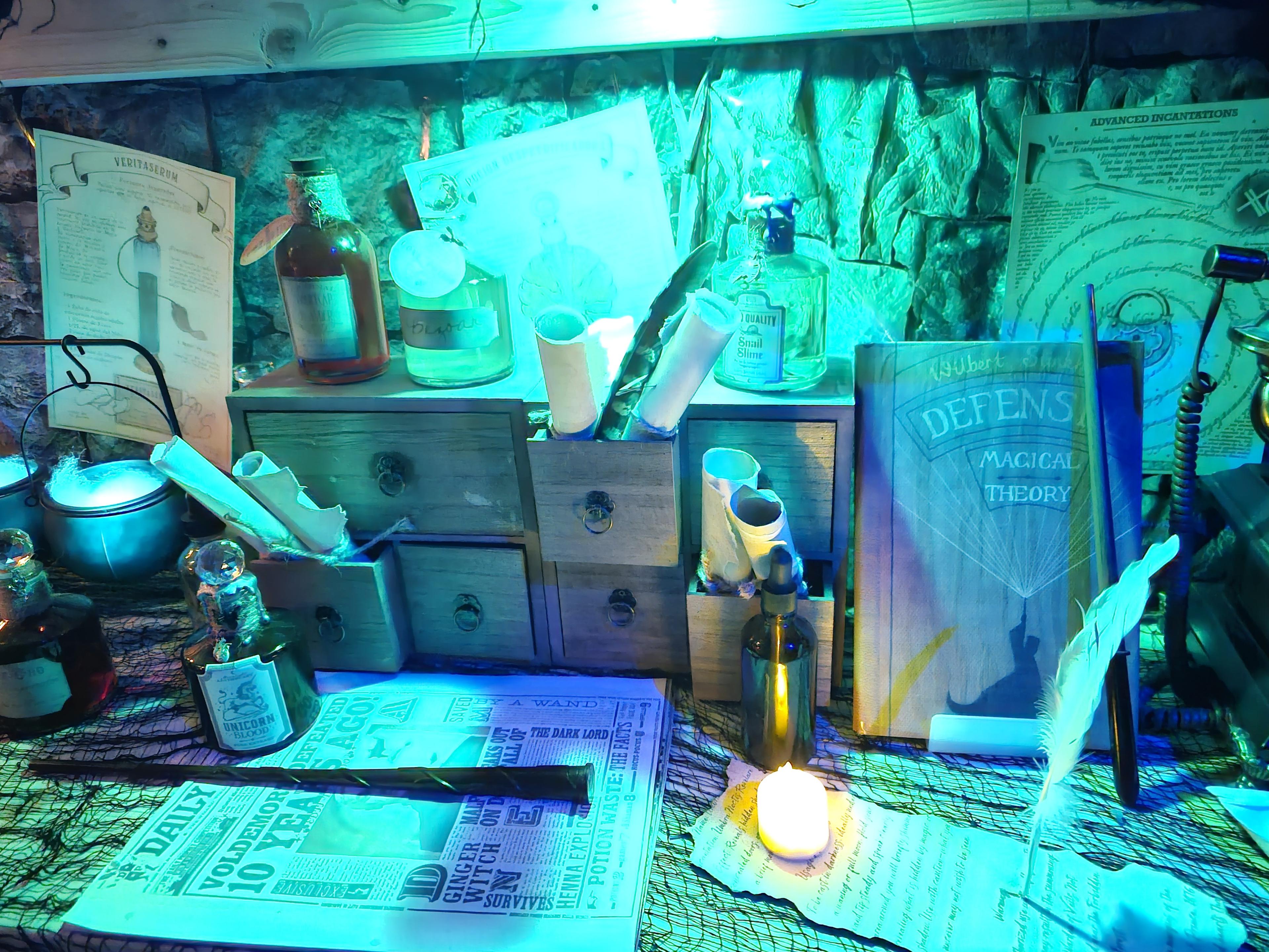 A candlelit desk of potions, scrolls, and spellwork